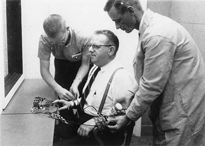 An actor being wired into the Stanley Milgram experiment