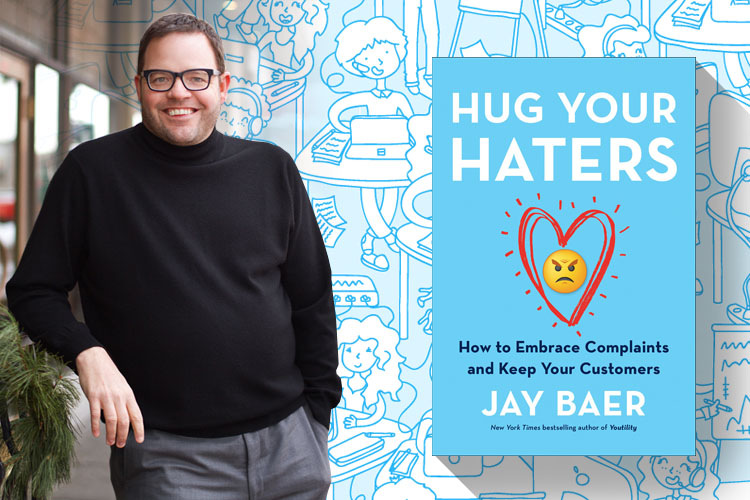 Jay Baer leaning on a planter box. The cover for the book: Hug Your Haters