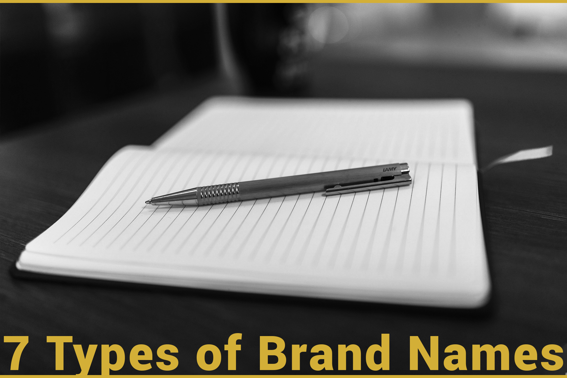7 types of brand names. A black and white photo of a pen on a notebook in a coffee shop.